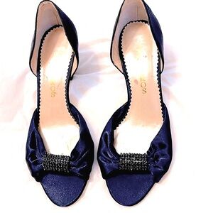 Beautiful navy blue satin dressy heels with stone accents at open toe.